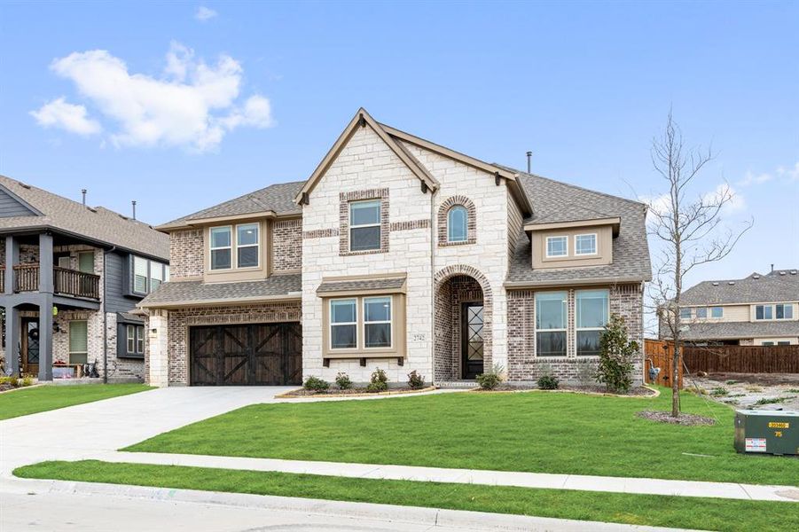 Front exterior of a new home in Terracina, Rockwall, TX, highlighting curb appeal (Image 2).