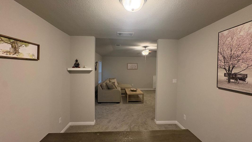 A well-lit interior reveals a comfortable living area, ready for relaxation.