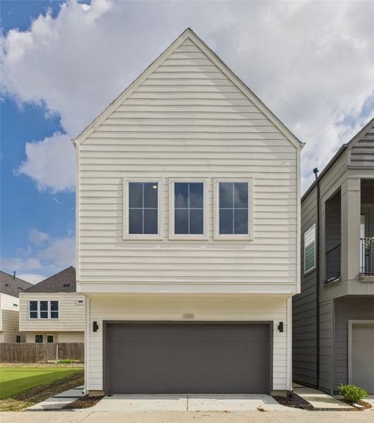 Front exterior of a new home in , Houston, TX, highlighting curb appeal (Image 1).