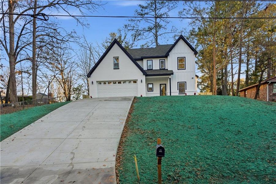 Front exterior of a new home in , Conyers, GA, highlighting curb appeal (Image 25). Front exterior of a new home in , Conyers, GA, highlighting curb appeal (Image 25).