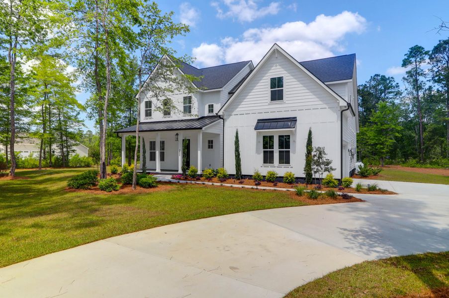 Front exterior of a new home in , Summerville, SC, highlighting curb appeal (Image 24).