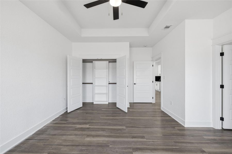 Bedroom 2 with custom-closet cabinets.