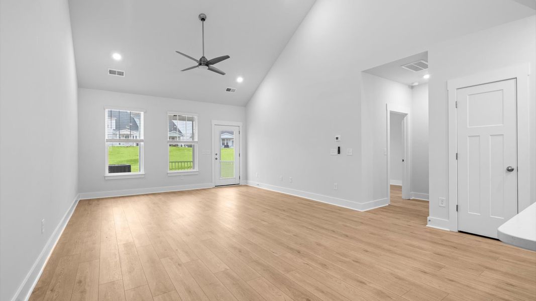 First-class living space featuring expansive ceilings, elegant design, and open sightlines to the kitchen