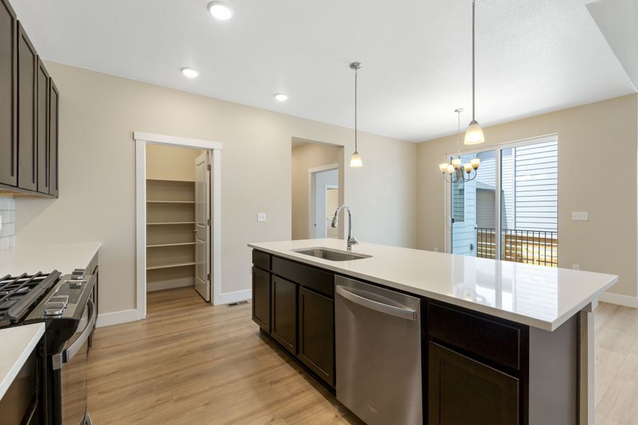 Experience luxury in this single-family home's modern kitchen, featuring elegant design and architecture.