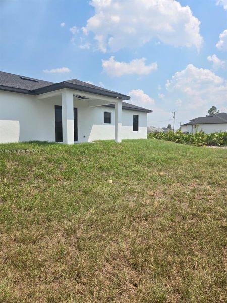Front exterior of a new home in , Lehigh Acres, FL, highlighting curb appeal (Image 19). Front exterior of a new home in , Lehigh Acres, FL, highlighting curb appeal (Image 19).