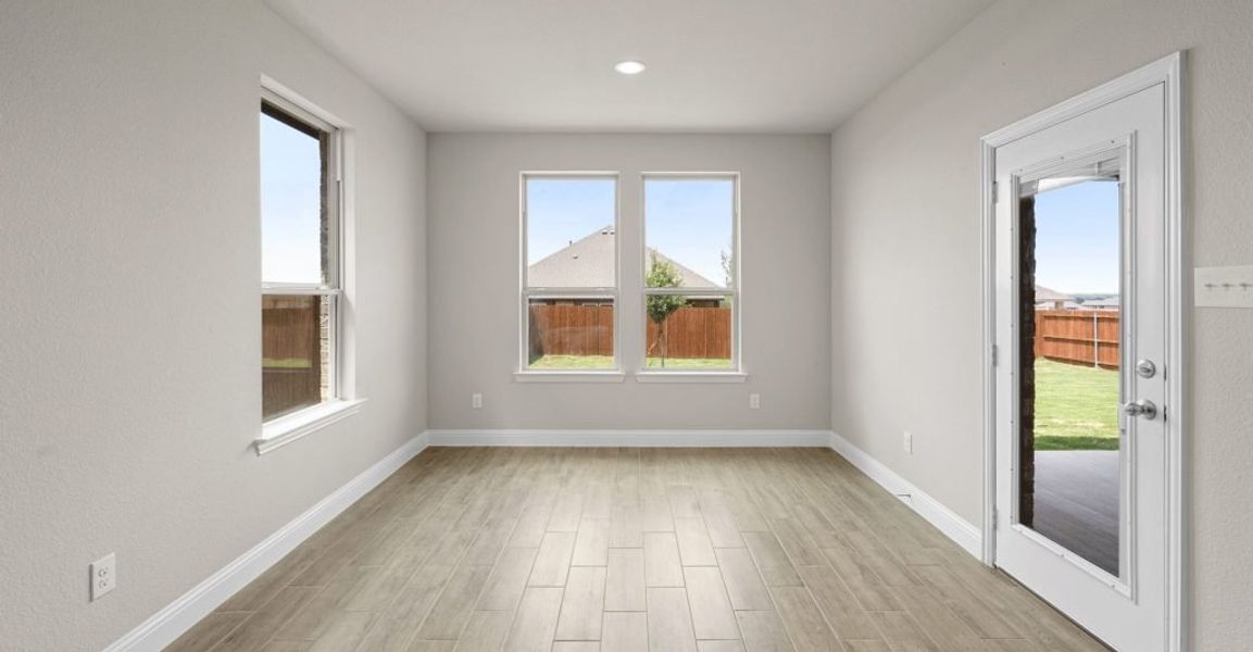 Representative exterior photo of a completed home built from the Donnington by Impression Homes in Still Water Lake, Godley, TX (Image 8).