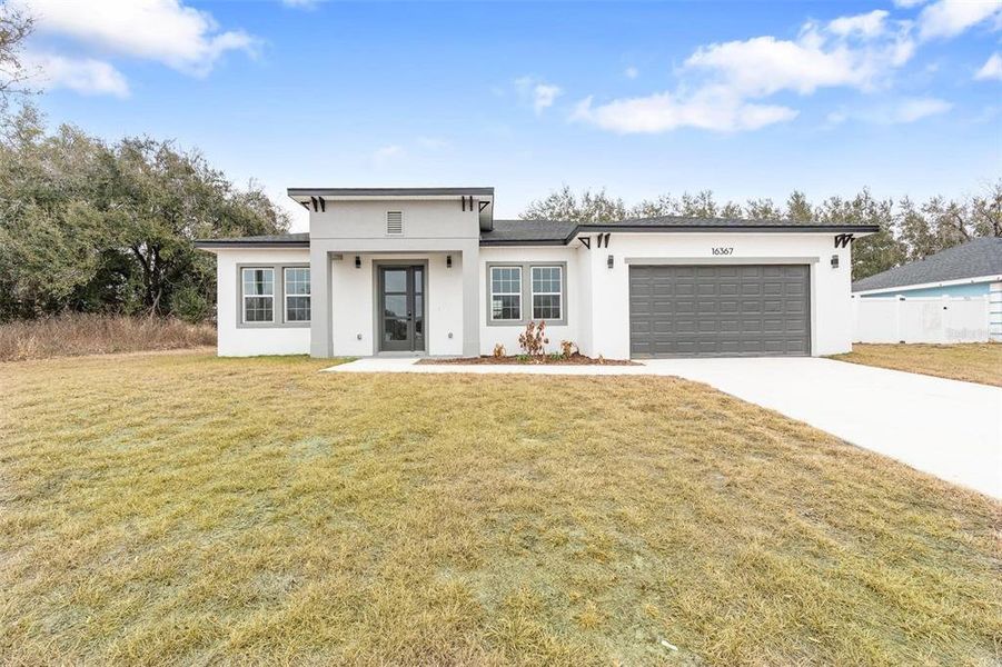 Front exterior of a new home in , Ocala, FL, highlighting curb appeal (Image 22).