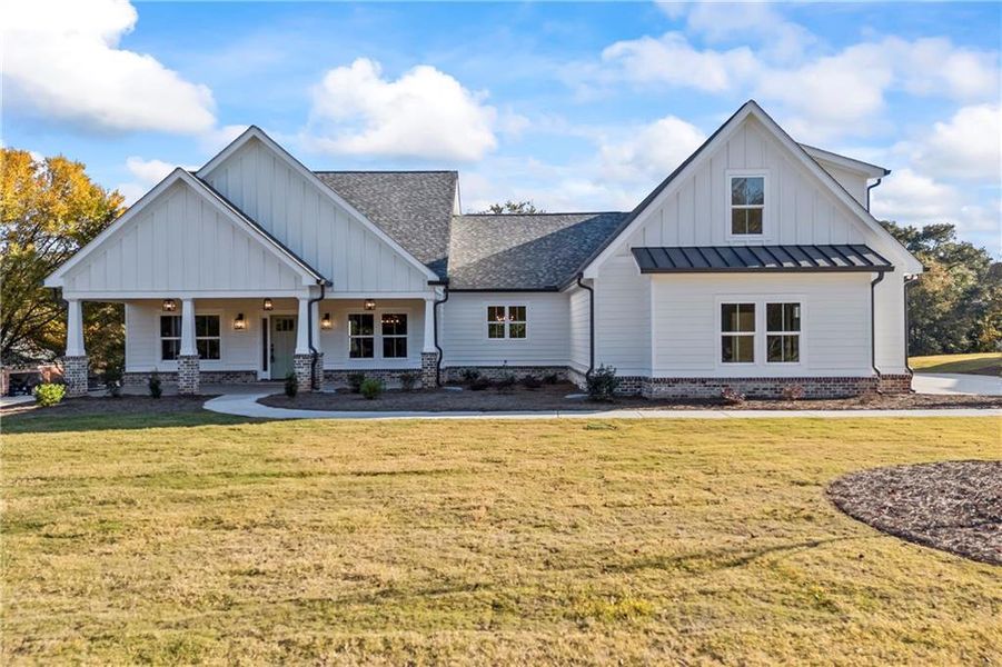 Front exterior of a new home in , Monroe, GA, highlighting curb appeal (Image 1).