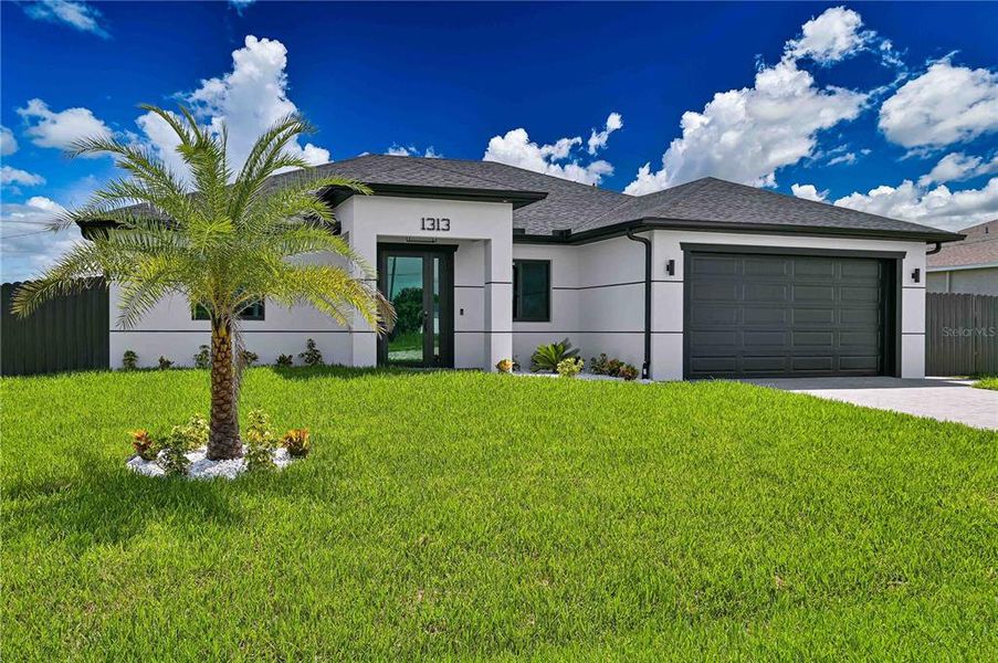 Front exterior of a new home in , Cape Coral, FL, highlighting curb appeal (Image 2). Front exterior of a new home in , Cape Coral, FL, highlighting curb appeal (Image 2).