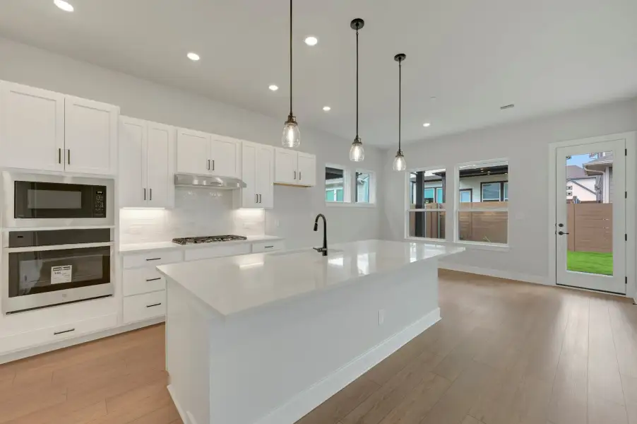 Furnished interior view inside a new home in Double Creek Crossing, Round Rock (Image 7).