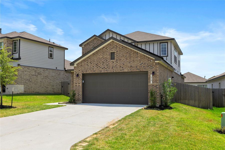 Front exterior of a new home in Lakes at Black Oak, Magnolia, TX, highlighting curb appeal (Image 24).
