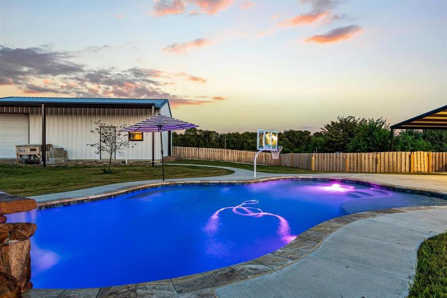 View of swimming pool featuring a fenced backyard and a patio View of swimming pool featuring a fenced backyard and a patio