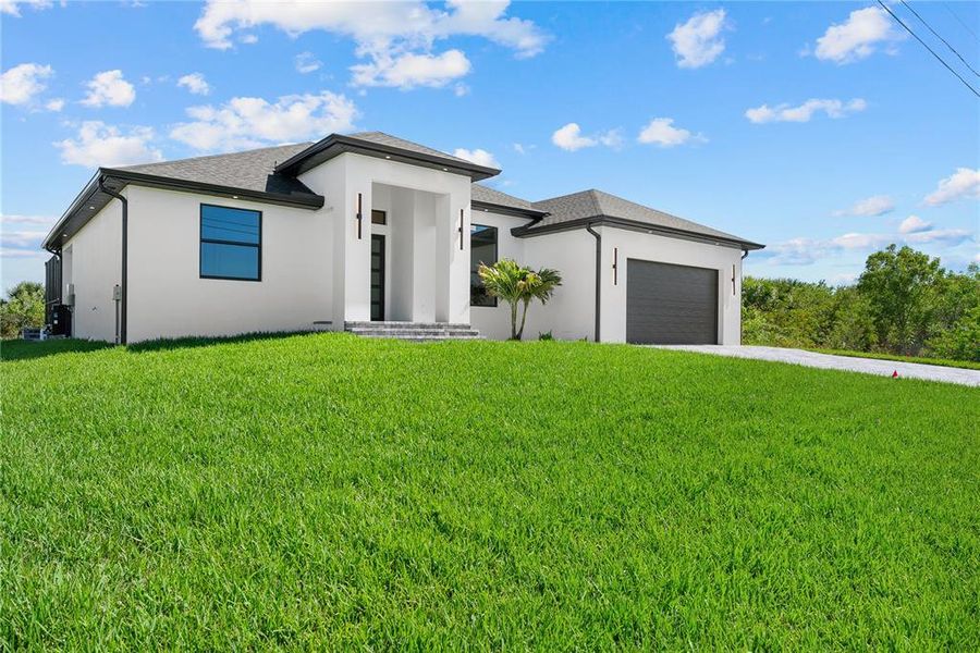 Front exterior of a new home in , Port Charlotte, FL, highlighting curb appeal (Image 1). Front exterior of a new home in , Port Charlotte, FL, highlighting curb appeal (Image 1).