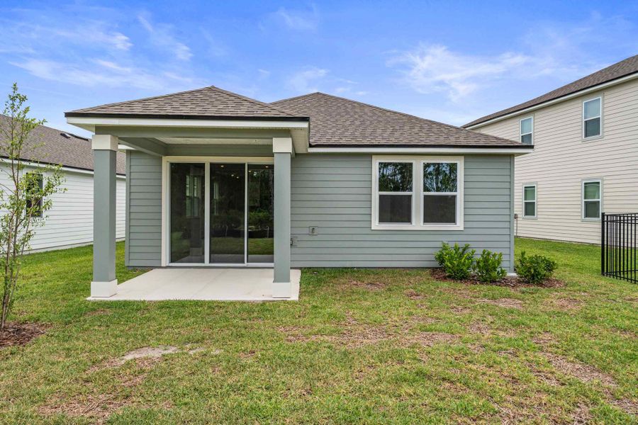 Sanibel II Floorplan Lot 72 Backyard with Covered Patio at Seminole Palms in Palm Coast