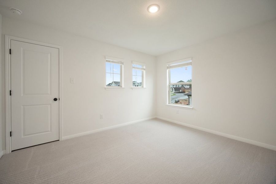 Spacious, unfurnished interior of a new home in The Hills of Bear Creek, Manchaca (Image 11).