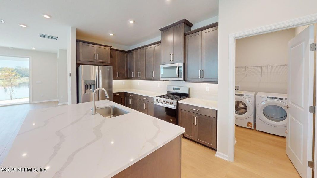 Furnished interior view inside a new home in RiverTown - WaterSong, St. Johns (Image 8).