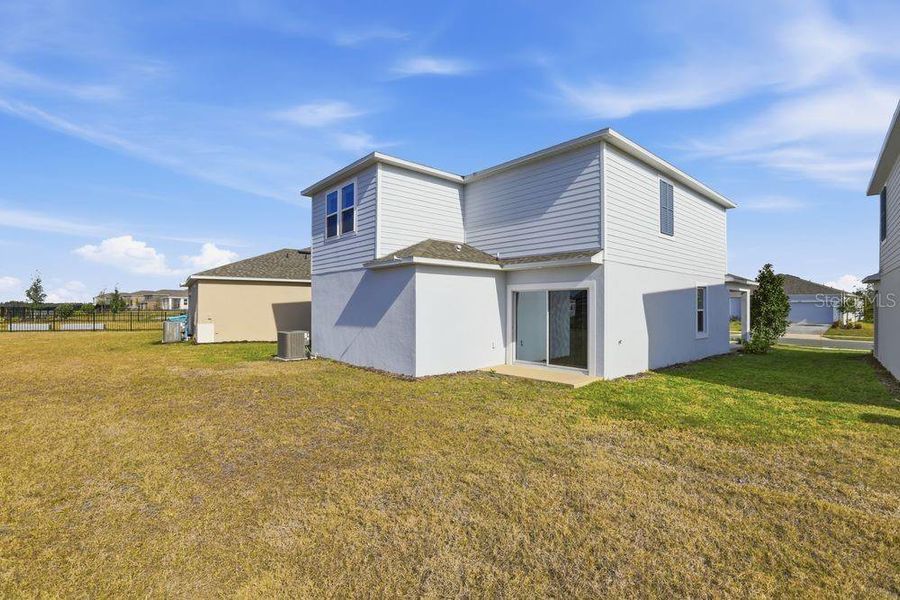 Exterior details and patio area of a home in Waterstone, Groveland (Image 22).