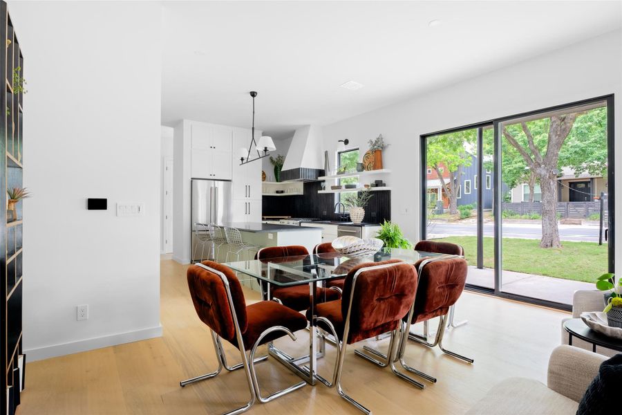 Dining space featuring light wood-style floors and baseboards