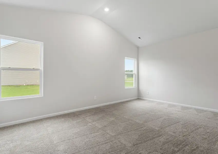 The master bedroom has plenty of space for your king-sized furniture