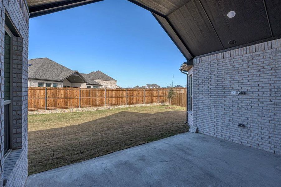 Exterior details and patio area of a home in Estates At Baker Park, Sherman (Image 23).