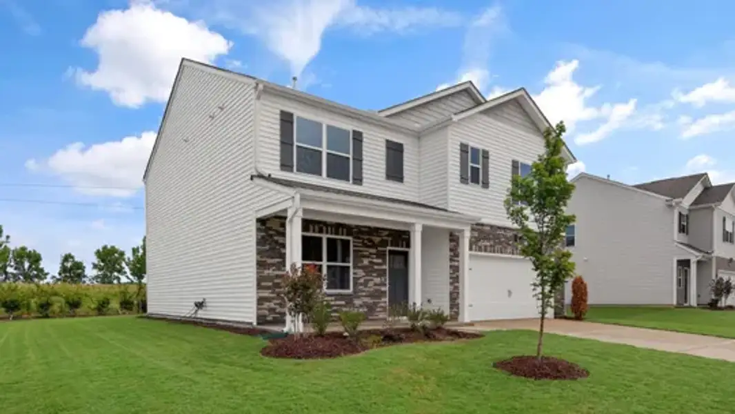 Front exterior of a new home in Martin Farms, Aberdeen, NC, highlighting curb appeal (Image 15).