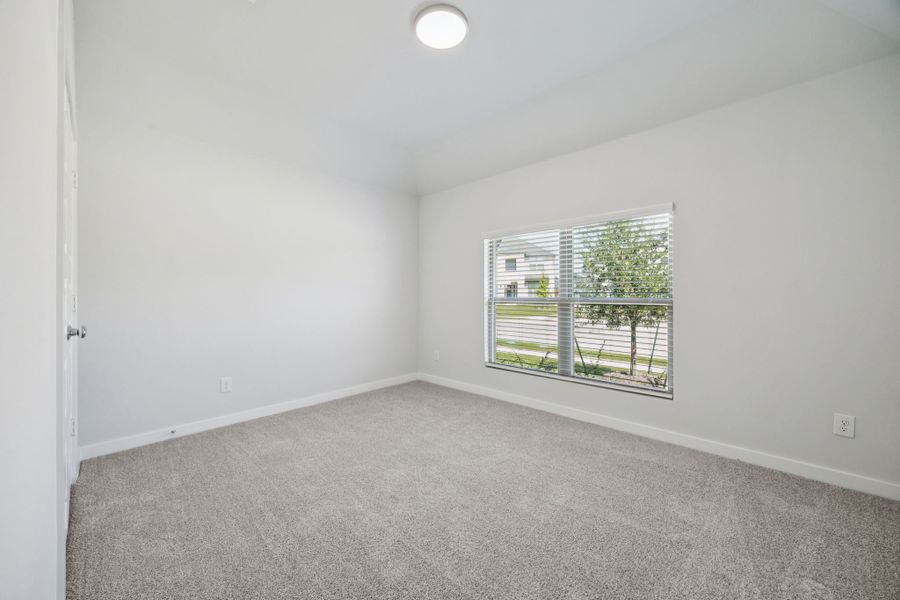 Bedroom in the Heisman home plan by Trophy Signature Homes – REPRESENTATIVE PHOTO Bedroom in the Heisman home plan by Trophy Signature Homes – REPRESENTATIVE PHOTO