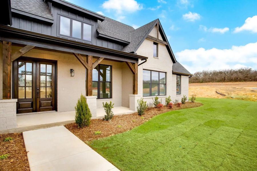 Representative exterior photo of a completed home built from the The Aubrey by Elmwood Custom Homes in Byrum Ranch, Maypearl, TX (Image 8).