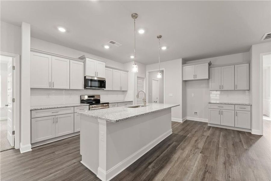 Furnished interior view inside a new home in Wood Creek Landing, Leland (Image 4).