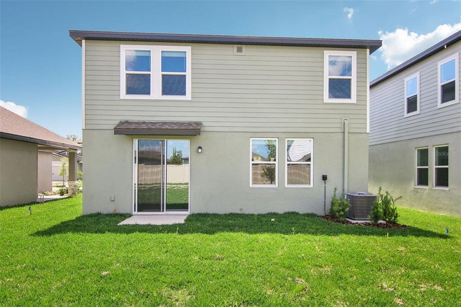 Front exterior of a new home in Two Rivers - Premier Series, Zephyrhills, FL, highlighting curb appeal (Image 12). Front exterior of a new home in Two Rivers - Premier Series, Zephyrhills, FL, highlighting curb appeal (Image 12).