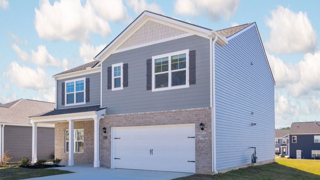 Front exterior of a new home in Hillcrest Landing, McDonald, TN, highlighting curb appeal (Image 17).