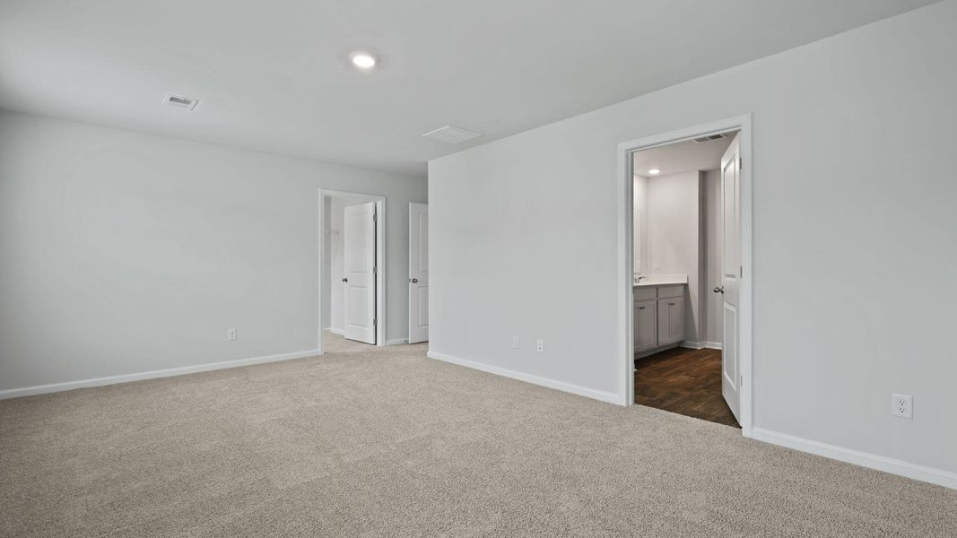 Spacious, unfurnished interior of a new home in Pine Hills at Cane Bay, Summerville (Image 24). Spacious, unfurnished interior of a new home in Pine Hills at Cane Bay, Summerville (Image 24).