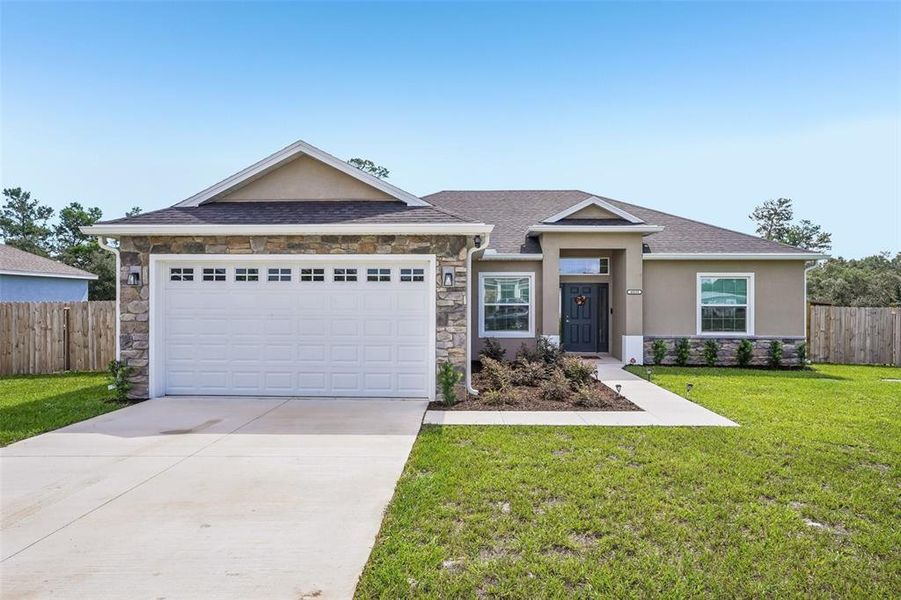 Front exterior of a new home in , Umatilla, FL, highlighting curb appeal (Image 23).
