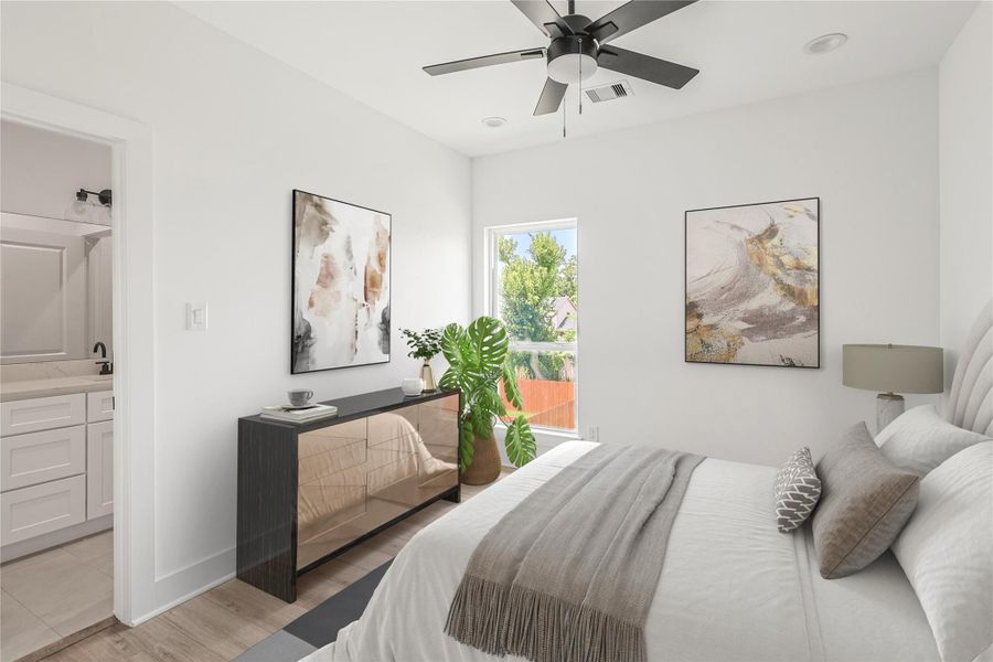 Comfortable third bedroom equipped with a ceiling fan and a private ensuite bathroom, providing a peaceful and convenient retreat for family members or guests.
