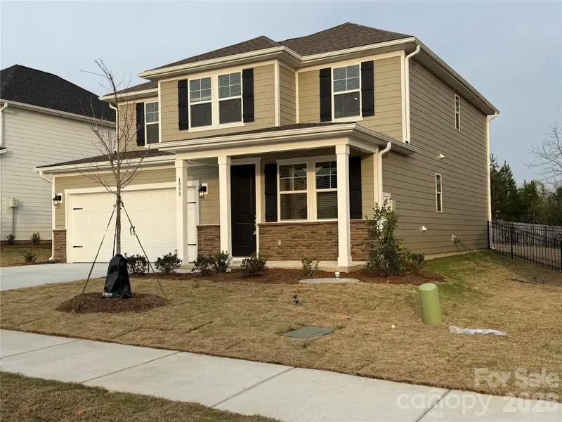 Front exterior of a new home in , Denver, NC, highlighting curb appeal (Image 11).