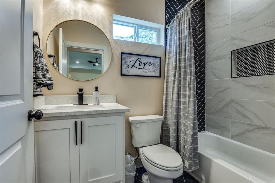 Beautiful hall bathroom with tub and full ceiling height tile Beautiful hall bathroom with tub and full ceiling height tile