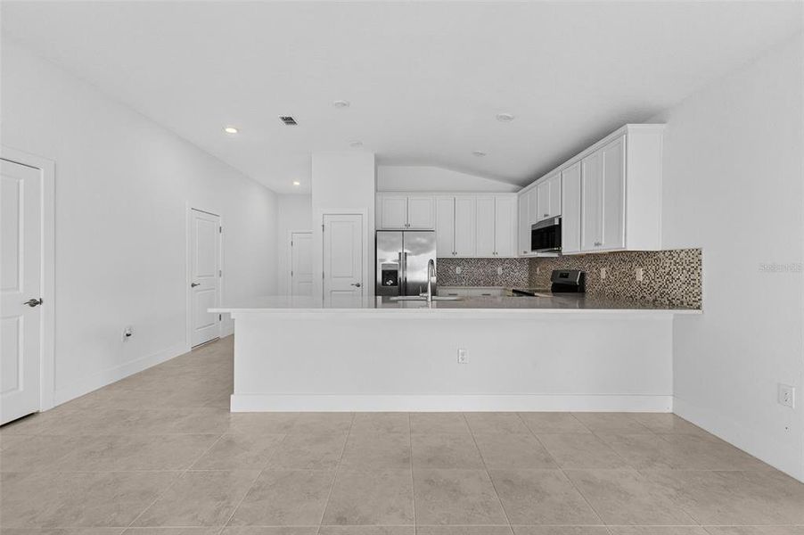 Furnished interior view inside a new home in , Port Charlotte (Image 9). Furnished interior view inside a new home in , Port Charlotte (Image 9).