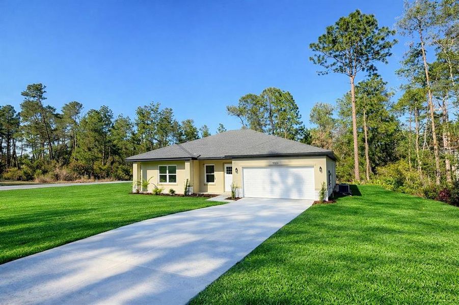 Front exterior of a new home in , Ocala, FL, highlighting curb appeal (Image 24).