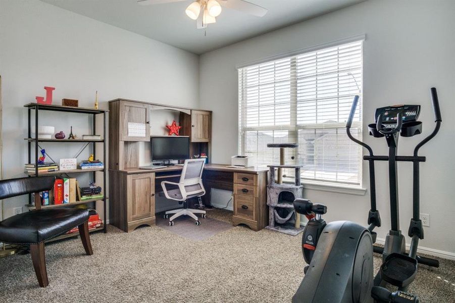 Office featuring baseboards, light colored carpet, and ceiling fan