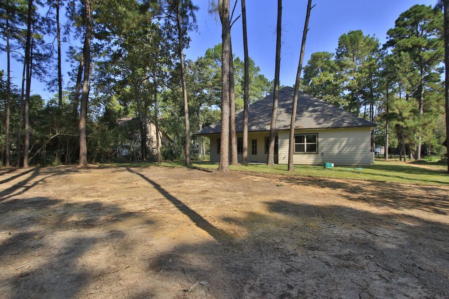 Front exterior of a new home in , Magnolia, TX, highlighting curb appeal (Image 19). Front exterior of a new home in , Magnolia, TX, highlighting curb appeal (Image 19).