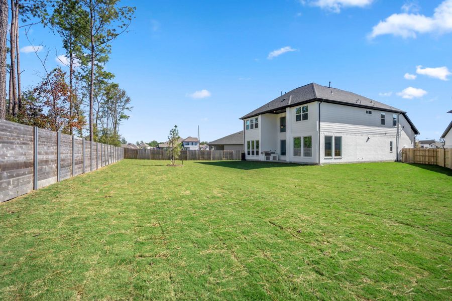 Exterior details and patio area of a home in ARTAVIA 55' Lots, Conroe (Image 29). Exterior details and patio area of a home in ARTAVIA 55' Lots, Conroe (Image 29).