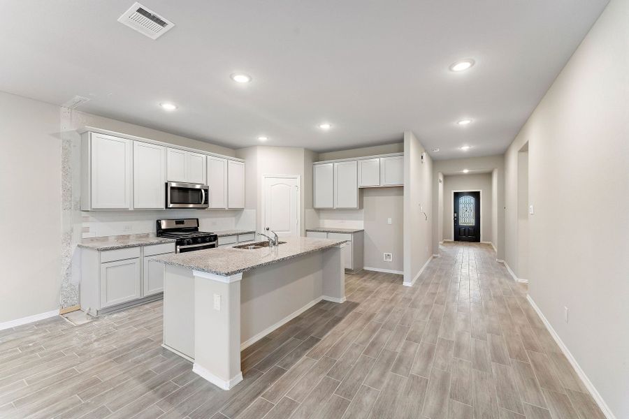 A kitchen with white cabinets. A kitchen with white cabinets.
