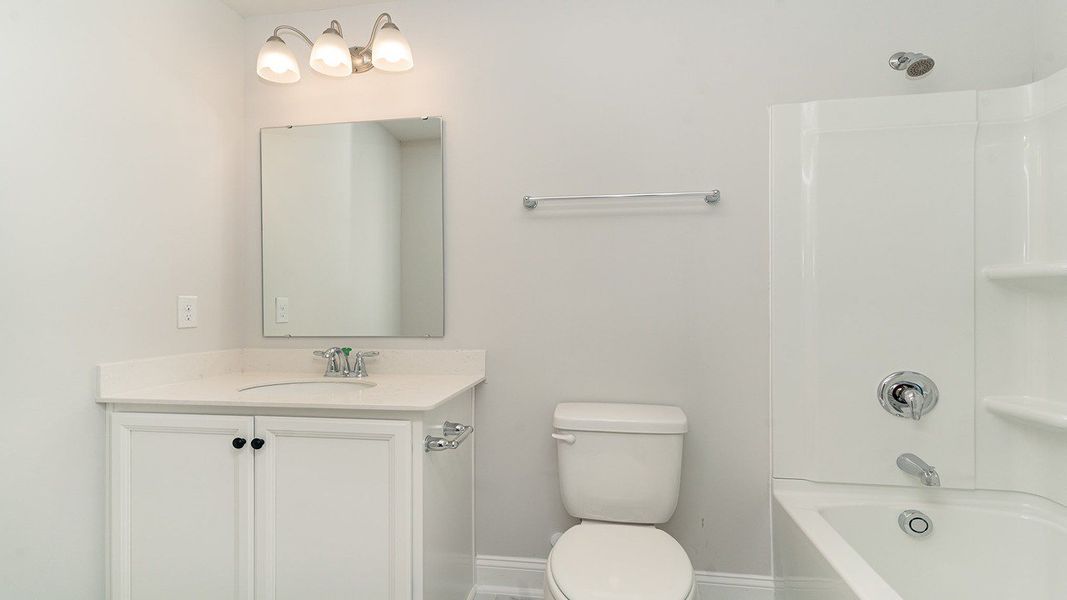 Representative furnished interior of a home built from the Belfort by D.R. Horton in Heron Pointe, Myrtle Beach (Image 11).