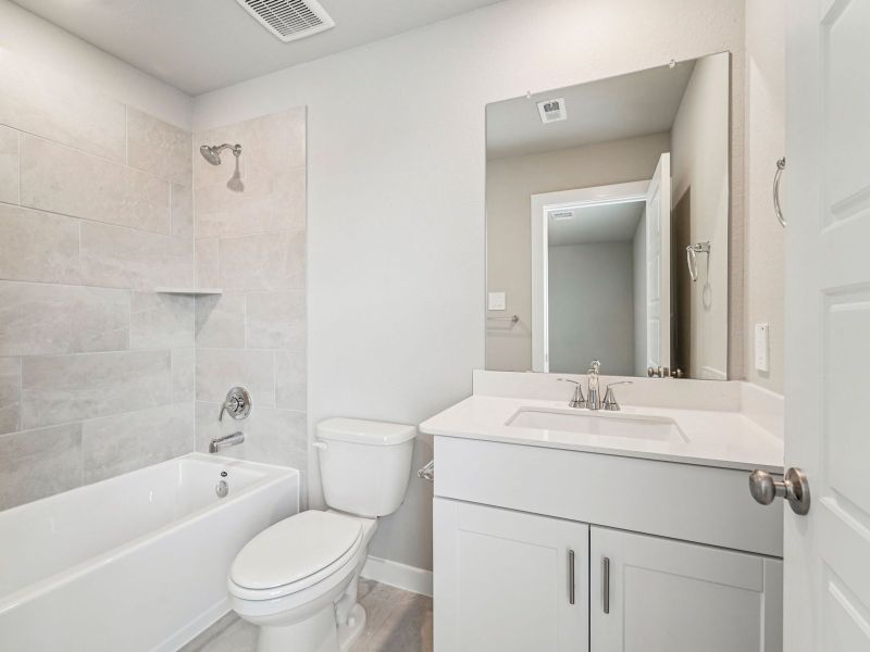 Furnished interior view inside a new home in Granger Pointe - Premier Series, Conroe (Image 12).