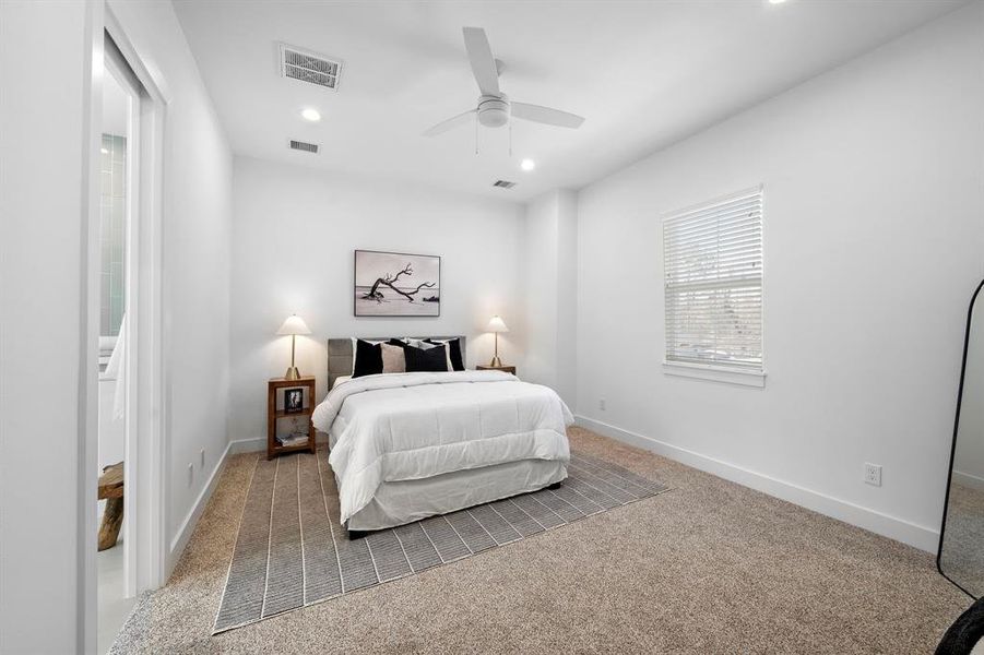 Sizeable primary bedroom with high ceilings!