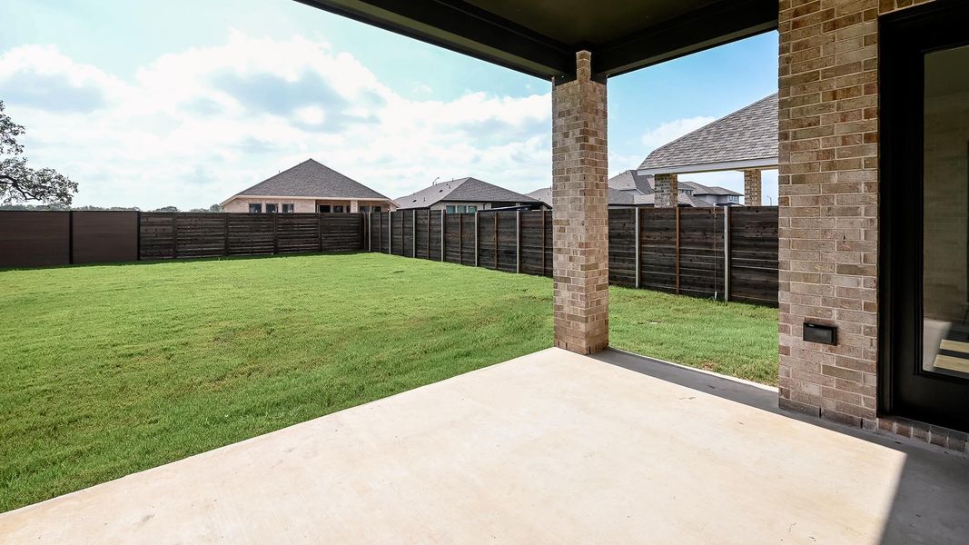 Exterior details and patio area of a home in Juniper Springs, Lockhart (Image 3).