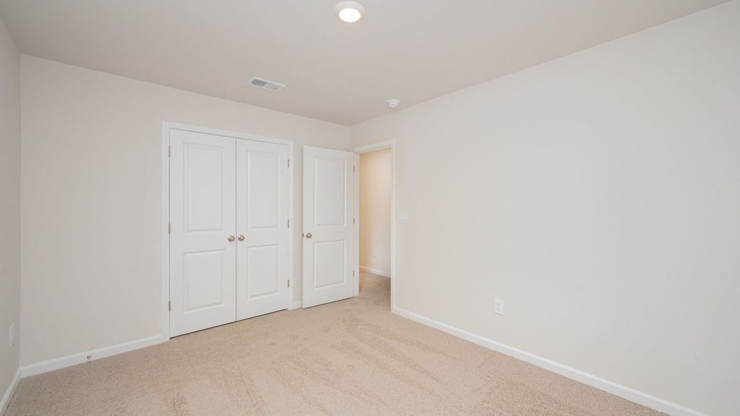 Spacious, unfurnished interior of a new home in Indigo Preserve, Leland (Image 25).