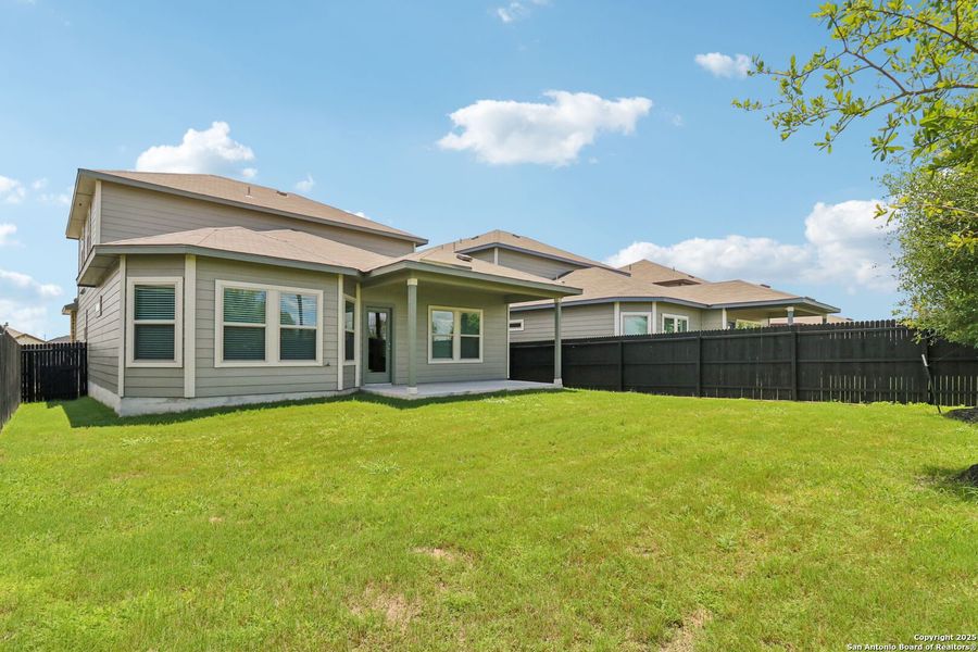 Front exterior of a new home in Remington Ranch, San Antonio, TX, highlighting curb appeal (Image 26). Front exterior of a new home in Remington Ranch, San Antonio, TX, highlighting curb appeal (Image 26).