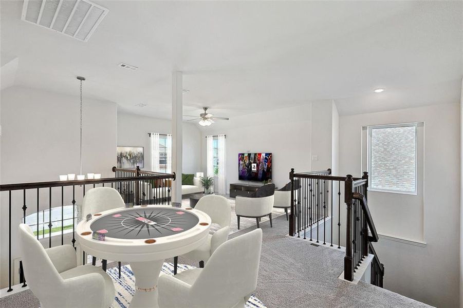 Dining space with a wealth of natural light and carpet