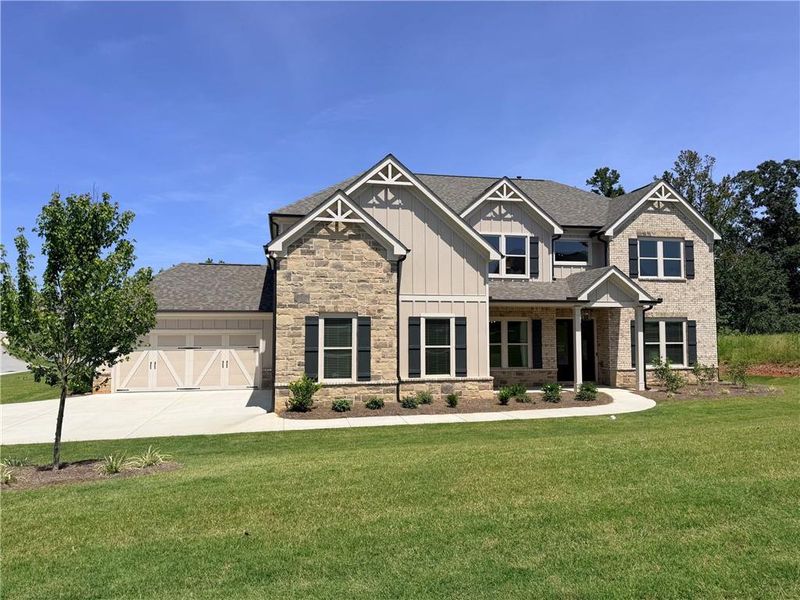 Front exterior of a new home in Sierra Lake, Cumming, GA, highlighting curb appeal (Image 1). Front exterior of a new home in Sierra Lake, Cumming, GA, highlighting curb appeal (Image 1).
