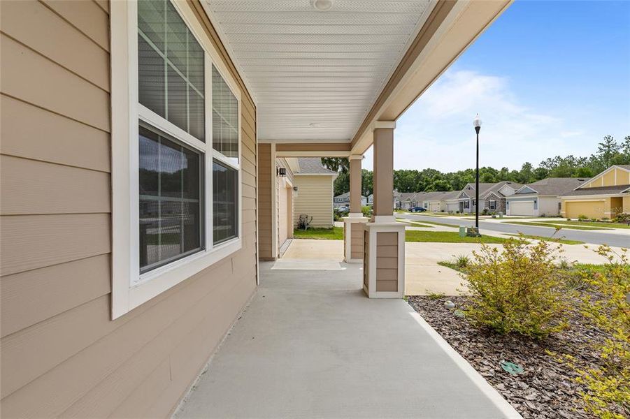 Front exterior of a new home in Avalon Woods, Newberry, FL, highlighting curb appeal (Image 21).